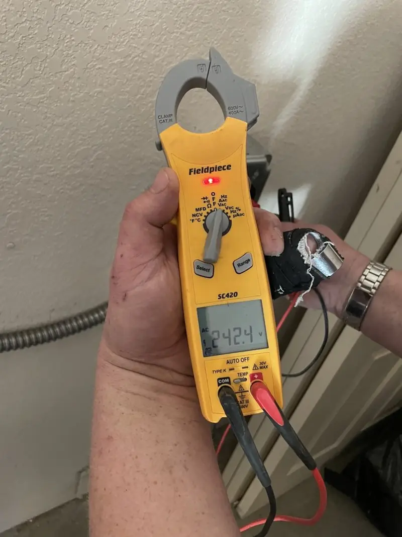 Voltage testing with clamp meter during Electrical Installation Services in Sawgrass